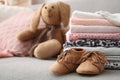 Toy bunny, stack of stylish child clothes Royalty Free Stock Photo