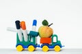 Toy car with apple and trailer Royalty Free Stock Photo