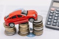 toy car balancing increasing coin stack. High quality photo Royalty Free Stock Photo