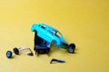 Toy car broken into pieces, wheels and glass fell off Royalty Free Stock Photo