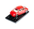 Toy car and calculator concept for insurance, buying, renting, fuel or service and repair costs Royalty Free Stock Photo