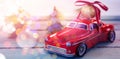 Toy car carrying christmas bauble ball on wooden plank Royalty Free Stock Photo