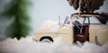 Toy car carrying pine cone on fake snow Royalty Free Stock Photo