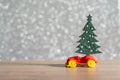 Toy Car with Christmas tree and gift box. Christmas landscape with gifts and snow. Merry christmas and happy new year greeting car Royalty Free Stock Photo