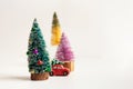 Toy Car With Chrstmas Tree And Three Small Colorful Christmas Trees
