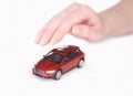 Toy car covered with female hand Royalty Free Stock Photo