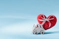 toy car delivering craft knitted heart for Valentine's day Royalty Free Stock Photo
