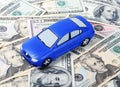 The toy car for dollar banknotes as a background Royalty Free Stock Photo