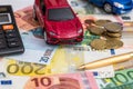 toy car on Euro cash with calculator and pen Royalty Free Stock Photo