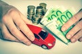 Toy car and euro money - insurance, rent and buying car Royalty Free Stock Photo