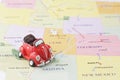 Toy car on map Royalty Free Stock Photo