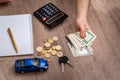 Toy car, money, calculator, notebook Royalty Free Stock Photo