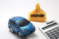 Toy car, money, calculator, and notebook Royalty Free Stock Photo