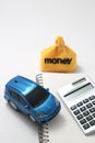Toy car, money, calculator, and notebook Royalty Free Stock Photo