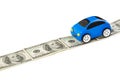 Toy car on money road