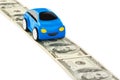 Toy car on money road