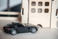 toy car near wooden garage. car parked, childs toy Royalty Free Stock Photo