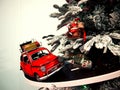 Toy car rides on the road around the Christmas tree Royalty Free Stock Photo