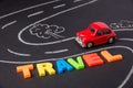 Toy car on the road and inscription plastic letters summer trave