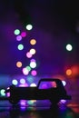 Toy car silhouettes over Christmas light Bokeh background. Vintage Toy car and bokeh stock photo