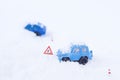 Toy car stucked in a snowbank