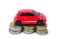 Toy car on top of stacks of coins Royalty Free Stock Photo