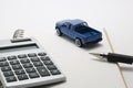 Toy car truck, calculator, notebook, and pen. Royalty Free Stock Photo