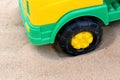 Wheel of a toy car on the sand Royalty Free Stock Photo