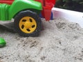 toy car wheel in the sand. Sand toys for children Royalty Free Stock Photo