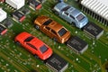 Toy cars on electronic board and microchip. The shortage of microchips and semiconductors creates a shortage of new cars. Royalty Free Stock Photo