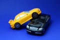 toy cars hit each other simulating an accident