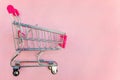 Toy cart on pastel pink background Royalty Free Stock Photo