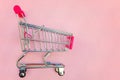 Toy cart on pastel pink background Royalty Free Stock Photo