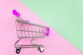 Toy cart on pastel pink and green background Royalty Free Stock Photo