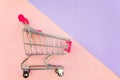 Toy cart on pastel pink and violet background Royalty Free Stock Photo