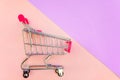 Toy cart on pastel pink and violet background Royalty Free Stock Photo