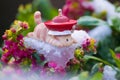 Toy cat lie prone on ice of flowers Royalty Free Stock Photo