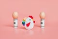 toy chicken and eggshells with 100 dollar bills. concept. pink background Royalty Free Stock Photo