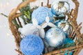Toy for the Christmas tree in the form of a dog lies on a background of blue Christmas balls. 3d toys Royalty Free Stock Photo