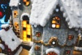 Toy Christmas village with miniature houses covered in snow Royalty Free Stock Photo