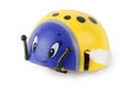 Toy clockwork yellow ladybird with blue face Royalty Free Stock Photo
