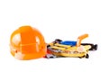 Toy construction helmet and tools over Royalty Free Stock Photo