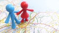 A toy couple standing over Edinburgh on a map of Scotland Royalty Free Stock Photo