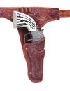 Toy cowboy pistol in holster isolated.