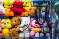 Toy crane vending machine, claw game or cabinet to catch the toys. Shopping, holiday activity, game of chance. Selective Royalty Free Stock Photo