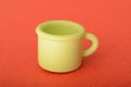 Toy cup isolated on a red background Royalty Free Stock Photo