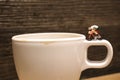 toy cyclist is taking a ride on mug Royalty Free Stock Photo