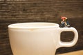 toy cyclist is taking a ride on mug Royalty Free Stock Photo