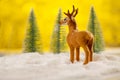 Toy deer made on christmas winter background