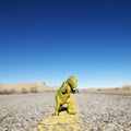 Toy dinosaur in road. Royalty Free Stock Photo